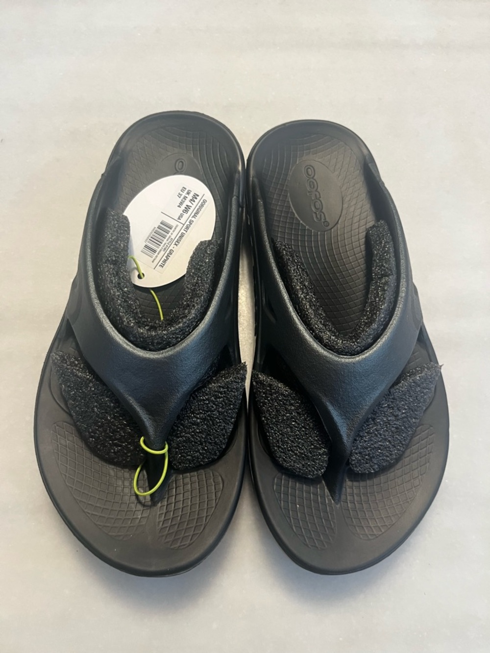 OOFOS Graphite Black Foam Toe-Post Sandals with Neon Accent
